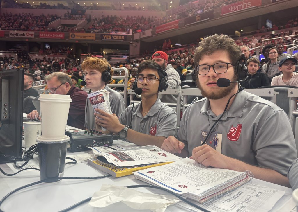 Announcers anxiously await the beginning of Quarter 1